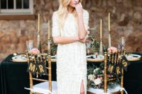 07 an ultra-modern wedding gown with long sleeves, a slit and with white sequins all over the dress