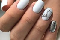 07 white nails with a single silver glitter one and a geometric one with a touch of silver glitter for a chic holiday look