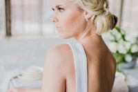 08 a simple low updo with waves is all you need for a simple and effortlessly chic bridal look, great for a modern bride