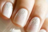 08 nude nails with a touch of glitter are winter and holiday classics that always works