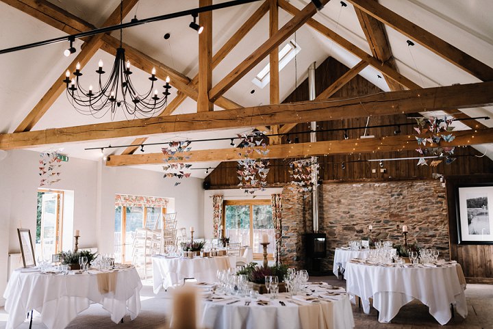 The wedding venue was light-filled, with paper cranes hanging in the air
