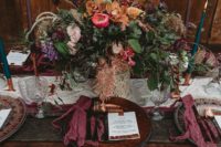 09 There was a macrame and colorful table runner, purple napkins, colorful candles and a luxurious moody centerpiece