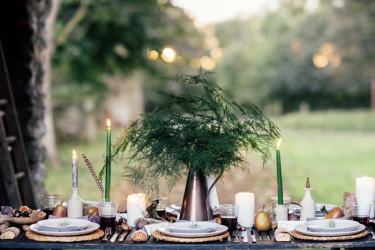 A simple Nordic wedding centerpiece of a vintage jug and ferns is great for a fall woodland inspired fete