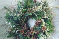 10 a cool winter wedding wreath with evergreens, pinecones, berries, twigs and ferns will be a nice venue decoration