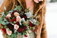 11 a winter wedding bouquet of burgundy, red and blush blooms plus pale greenery and eucalyptus