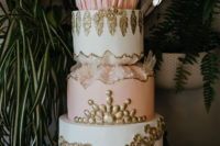 12 The wedding cake wa s aregal one with edible gold patterns, geodes and rhinestones for a Victorian touch