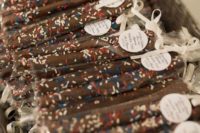 13 chocolate pretzel sticks are a great idea of a foodie wedding favor for any season and theme