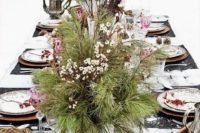 13 evergreens and berries, branches in vintage urns amd pinecones for a cozy winter Scandinavian wedding