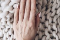 13 white, blush and gold glitter nails for a modern winter bridal manicure