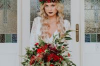 14 a lush cascading Christmas wedding bouquet with greenery and red blooms is Christmas classics