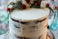 14 a semi naked wedding cake topped with herbs and blooms for an all-natural look
