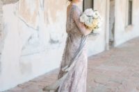 14 an airy grey lace wedding gown with long sleeves and a cutout back for an ethereal bridal look