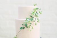 15 a blush minimalist wedding cake decorated with a greenery branch will work right for a summer Scandinavian wedding