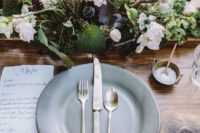 16 a chic natural wedding centerpiece with greenery and various moody and blush flowers for an elegant fall or late summer fete
