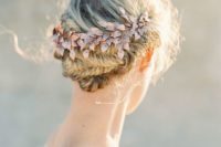 16 a fishtail braided updo accessorized with a rose gold hairpiece for a summer or spring Nordic wedding