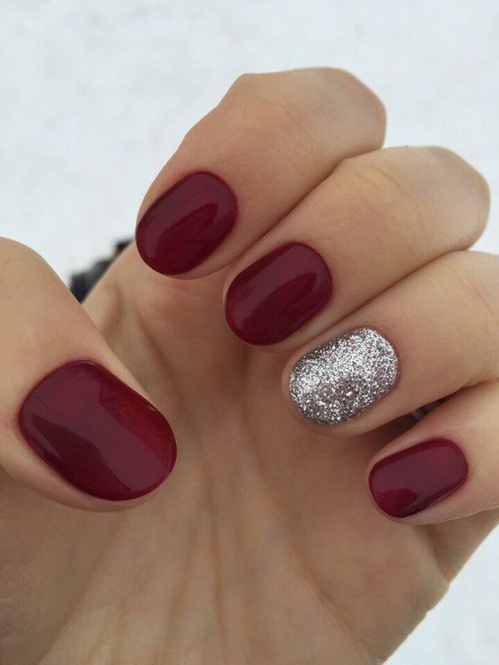 a classic red manicure spruced up with a silver glitter accent nail are perfect for Christmas
