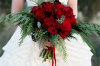 18 a Christmas wedding bouquet of evergreens, eucalyptus and red roses plus red ribbons
