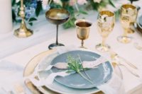 18 gold glasses and goblets, gold cutlery and chargers plsu candle holders for exquisite wedding table decor