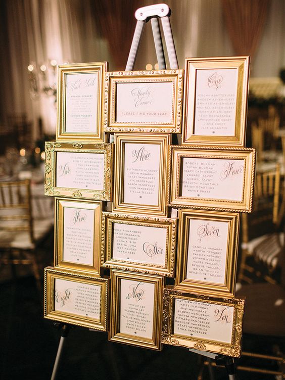 a refined seating plan with picture frames from thrift stores that were spray painted gold, such a cool idea