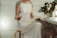 21 a plain sheath wedding dress with embellished cap sleeves, a train and an open back