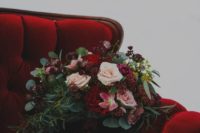 22 a luxurious rich wedding bouquet of blush and deep red blooms, lots of greenery and berries