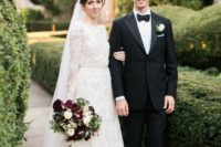 24 a vintage-inspired lace A-line wedding dress with long sleeves, a high neckline and a matching veil