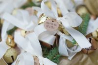 24 gold glitter jingle bells with ribbon bows can be used as decorations and as favors, too
