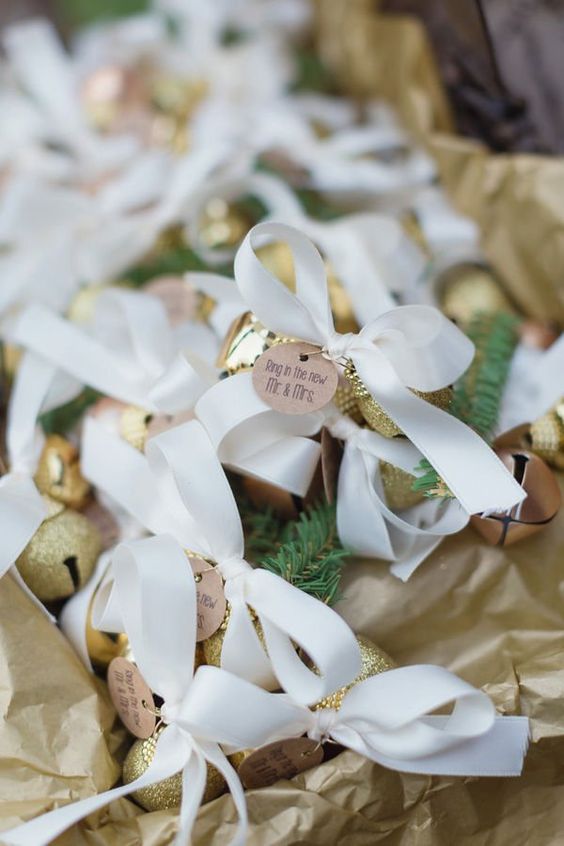 gold glitter jingle bells with ribbon bows can be used as decorations and as favors, too