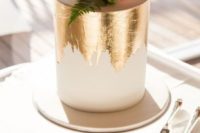 25 a modern wedding cake in white with gold leaf, blooms and succulents on top is a very trendy option to try