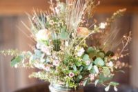 25 a summer wedding centerpiece of freshly picked wildflowers and greenery in a jar with twine can be easily DIYed