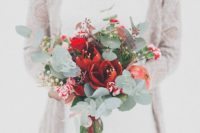 25 a tender bouquet with red blooms, pomegranate, eucalyptus and dark foliage for a Christmas wedding