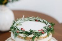 26 rosemary and pomegranate seeds on this gorgeous cake are a chic way to incorporate traditional holiday colors