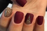 28 matte burgundy nails with a touch of gold glitter and a gold glitter nail for a bright festive manicure in winter