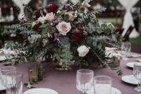 a catchy winter wedding with blush, white and burgundy roses, greenery and dried elements is a stylish idea for a bold wedding