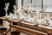 an organic winter wedding tablescape with white blooms, dried flowers and grasses, cotton buds and all white everything