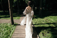 02 The bride was wearing a fantastic embroidered and embellished fitting wedding dress with a train and an illusion off the shoulder neckline