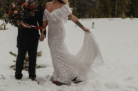 02 The bride was wearing an off the shoulder boho lace wedding dress and boots