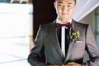 02 The groom was wearing a grey suit, a striped shirt and a burgundy bow tie