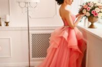 02 a coral ballgown with an embellished belt and a layered skirt with a train is a daring choice for 2019 bride