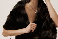 02 a dark fur shrug will contrast your wedding dress, make you stand out in the snow and it looks luxurious