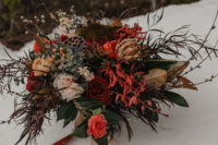03 Her bouquet was a super textural and lush one done in dark hues and with grasses and berries
