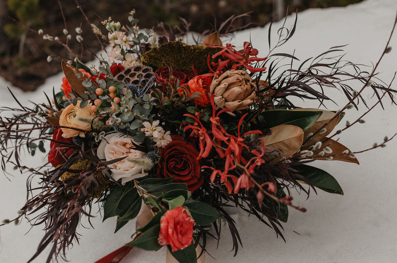 Her bouquet was a super textural and lush one done in dark hues and with grasses and berries