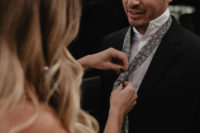 04 The groom was wearing a black suit with a floral print tie in grey
