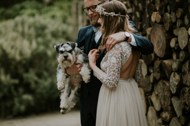 The groom was wearing a navy three-piece suit, a floral bow tie and the couple's dog was a ring bearer