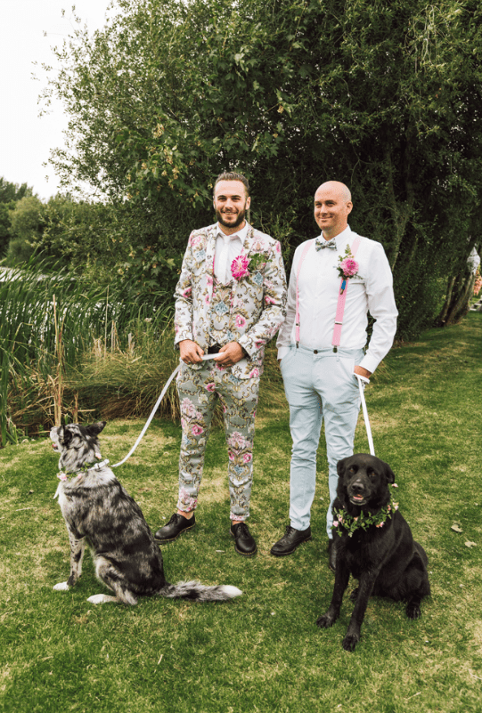 The groom was wearing a super trendy floral print three-piece suit, a white shirt and a white tie