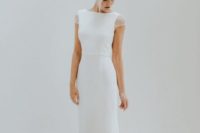 06 a simple fitting wedding dress with cap sleeves embellished with pearls and a high neckline