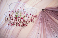 07 Bright florals with greenery were hanging down from embroidery hoops and there were many lights
