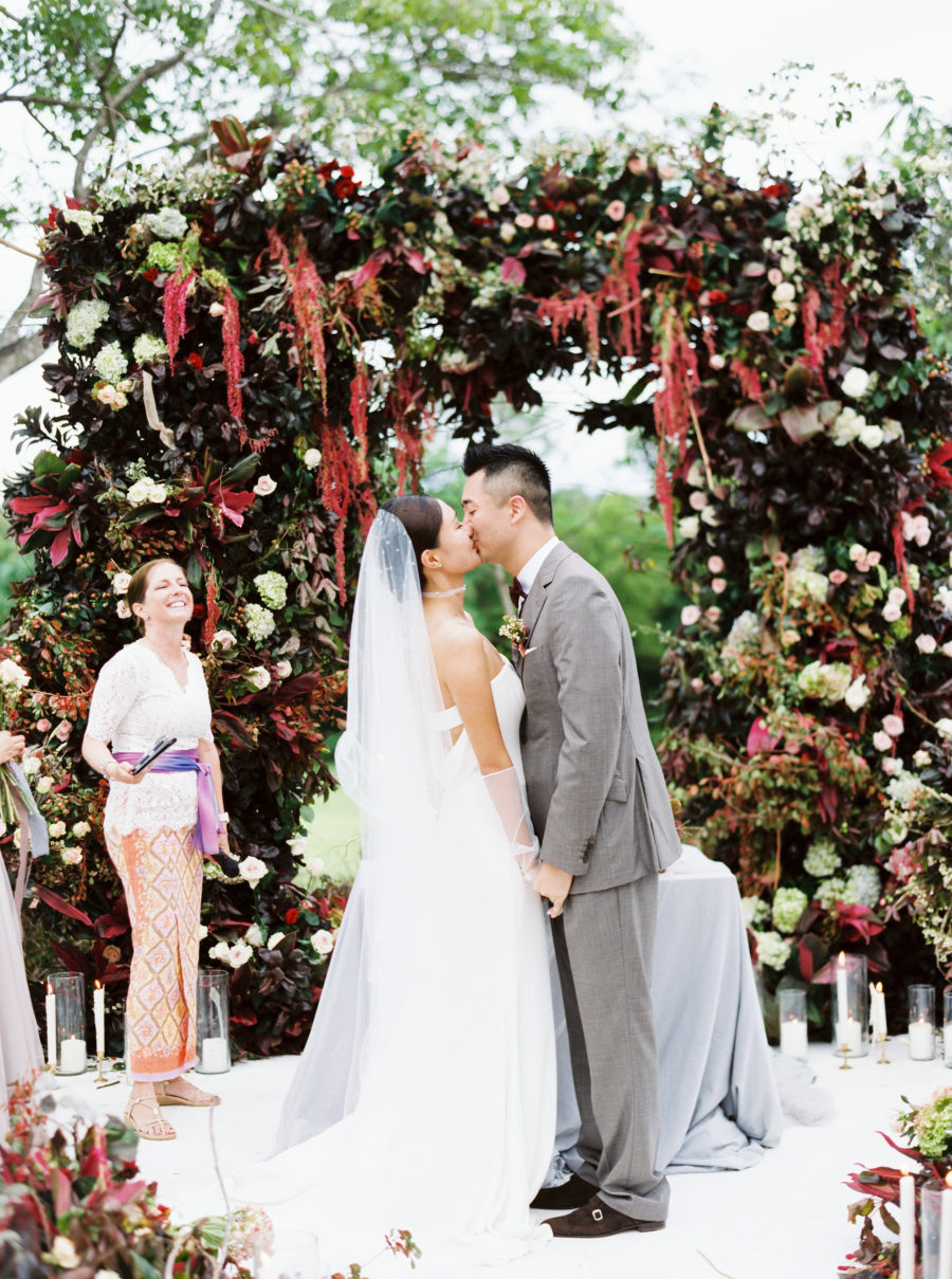 The wedding arch was very impressive, with lots of dark and bright blooms and much green and dark foliage