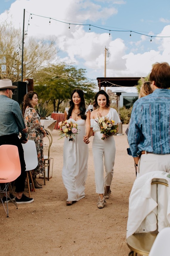 The bridesmaids were wearing whites, mismatching dresses and jumpsuits