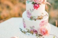 08 a colorful handpainted wedding cake with pink and lilac blooms and fresh blooms on top is amazing for summer